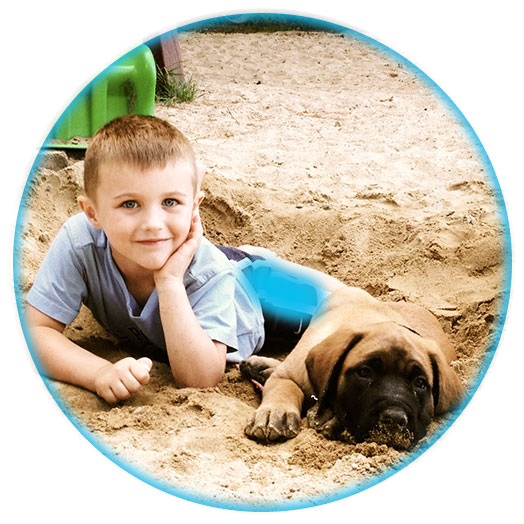 SoHo Kid with Puppy in the Sand